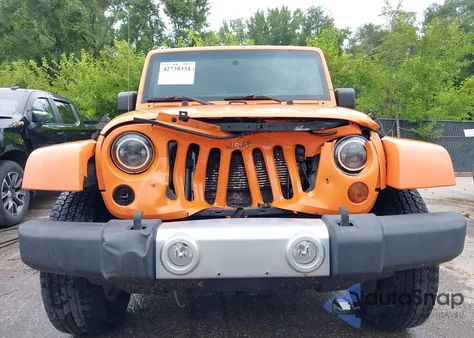 2012 Jeep Wrangler Unlimited Sahara z USA, uszkodzony, nr VIN 1C4BJWEG7CL163004